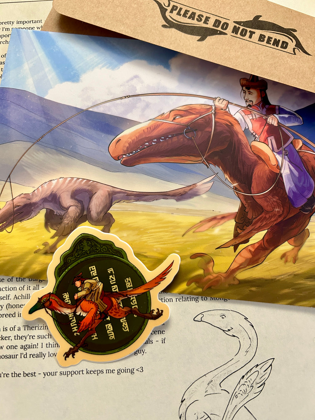 A promotional piece featuring the print, sticker, and letter connected to July's edition - all about the Mongol Empire.