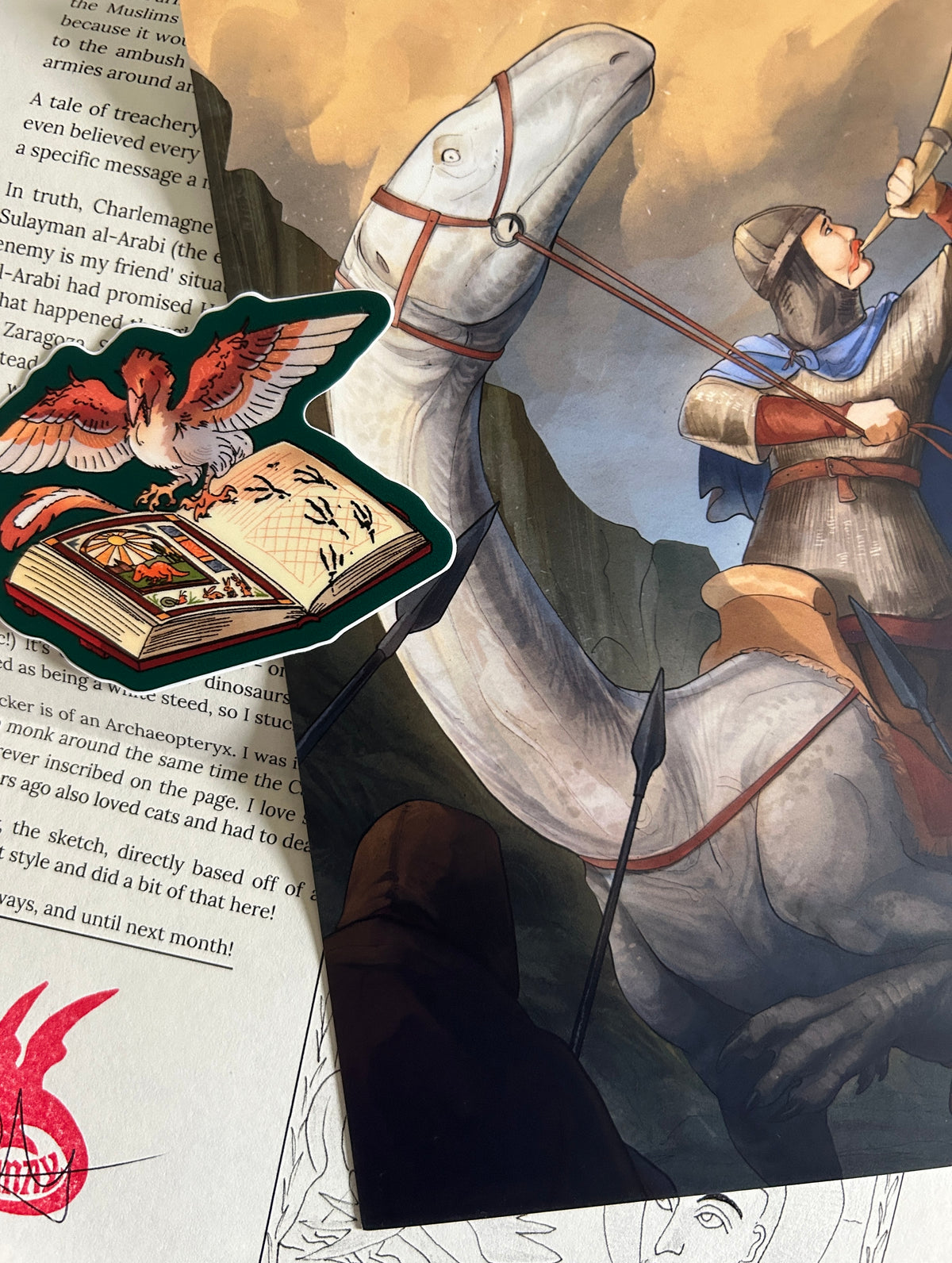 Print and sticker with letter in background.